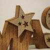 Deko-Objekt Holzschriftzug der Stern von Xmas mit Sternen glitzernd