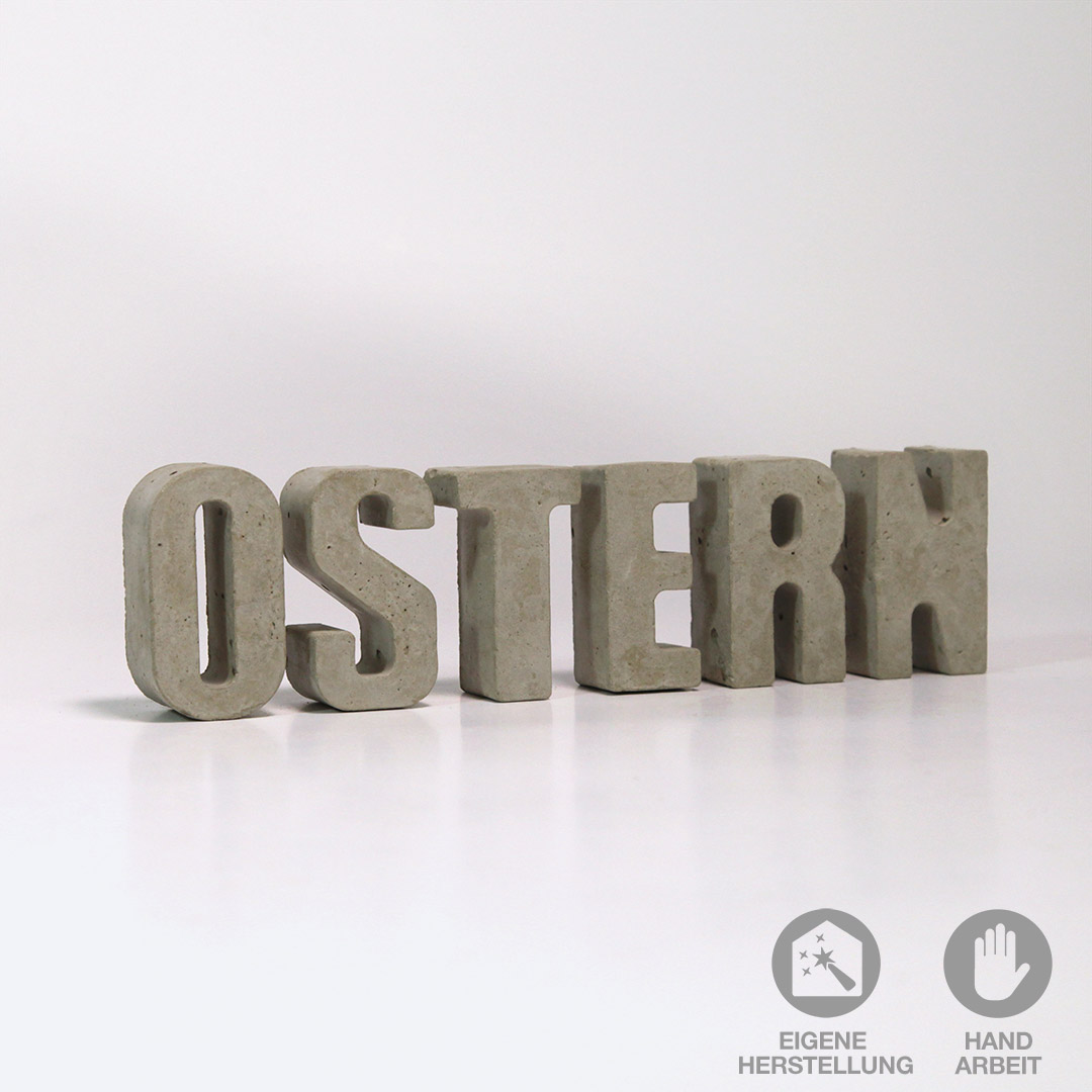 Das Wort "OSTERN" aus handgefertigten Beton-Buchstaben zum dekorieren.